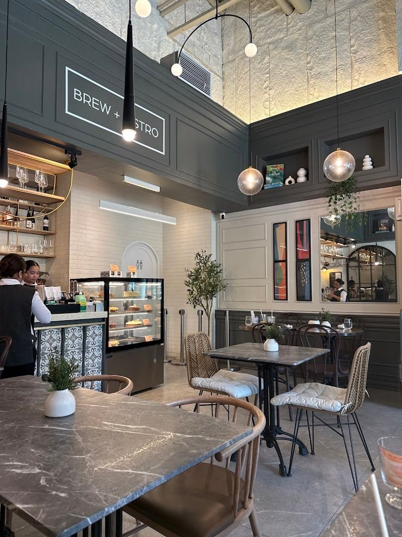 Manila Baker Brew and Bistro — marble table with flowers and bar counter